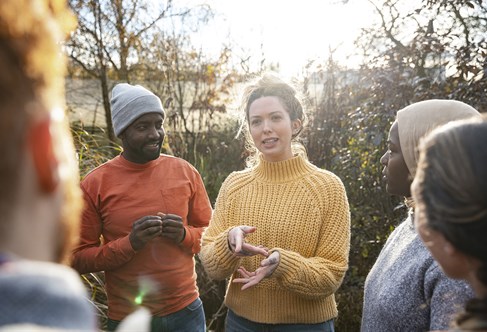 a group chatting in the countryside