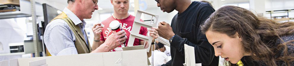 Architecture students assembling model