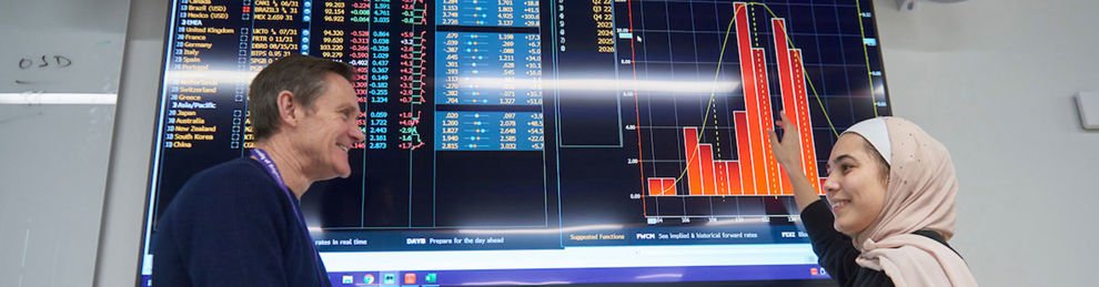 Student pointing at Bloomberg data