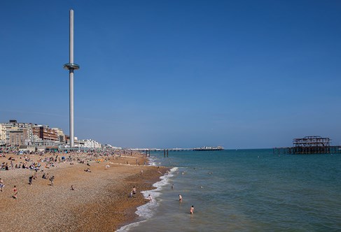Sunny Brighton seafront with busy beach
