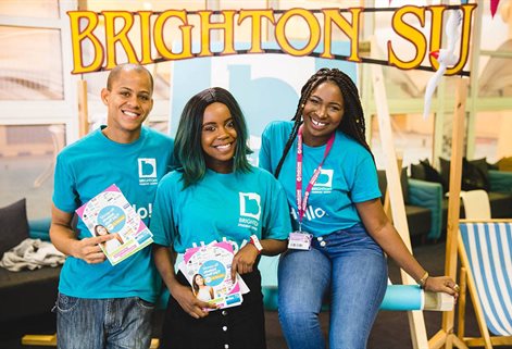 Three smiling students in blue BSU t-shirts