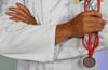 Doctor holding stethoscope image by Online Marketing on Unsplash
