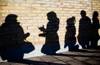 Girl gang members shadows on wall