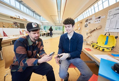 Lecturer and student discussing work in the studio