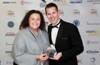 McKenzie receives her award from Barry Squires Head of Sport at the university