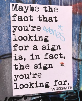 Poster reading Maybe the fact that you're looking for a sign is the sign you're looking for
