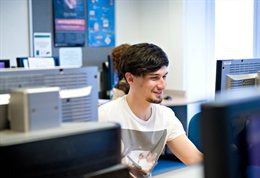 Student sitting in front of a computer