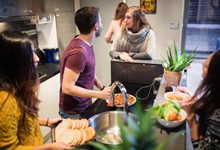 Students preparing food in kitchen