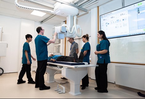 Students using the x-ray table