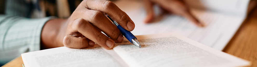 close up of hands and book